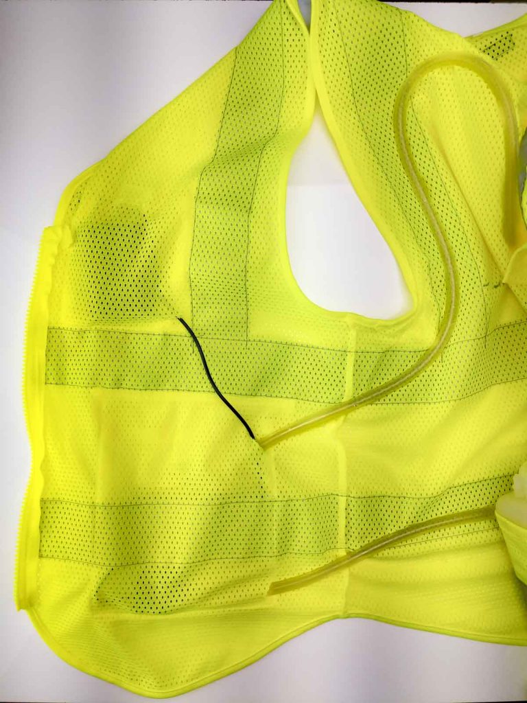 detail of mesh vest and silicone tubing