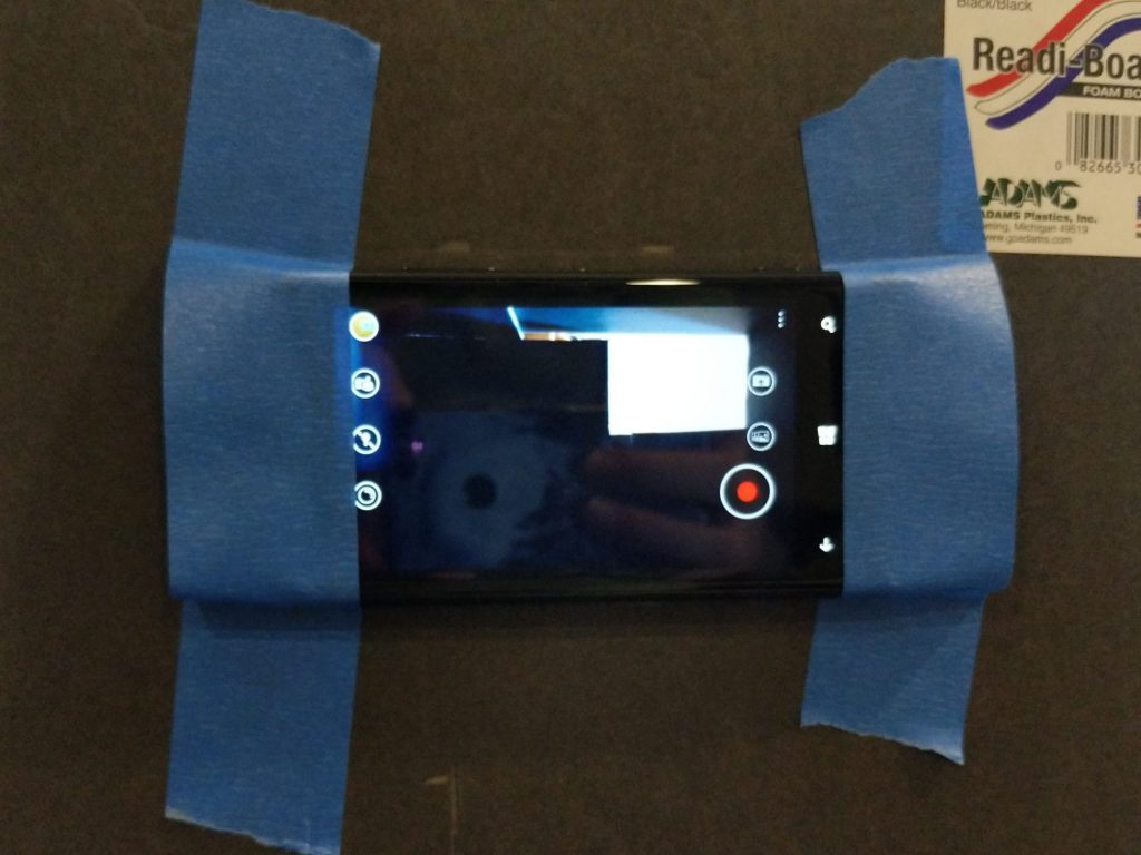 mobile phone taped down